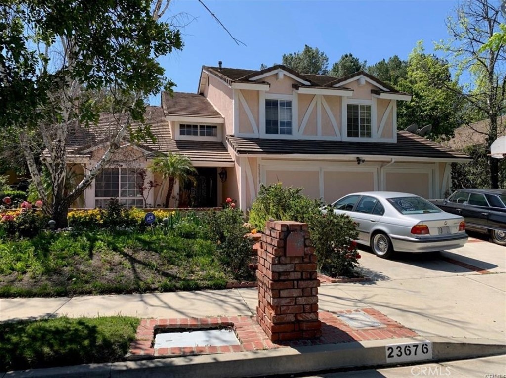 a front view of a house with parking