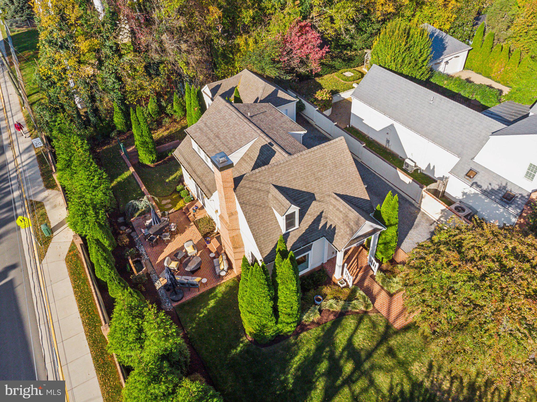 an aerial view of a house with a yard and swimming pool