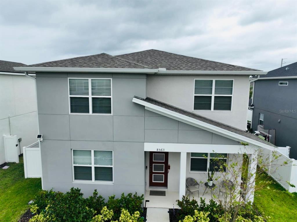 front view of a house with a small yard