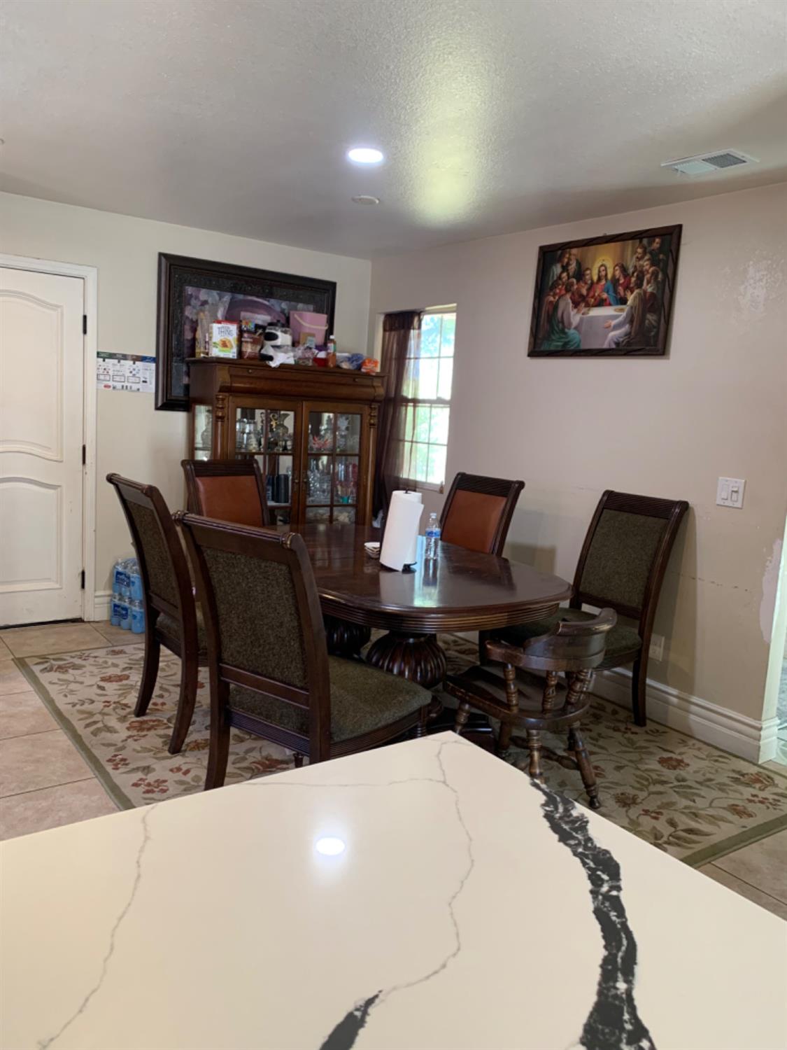 a work room with furniture and a bookshelf