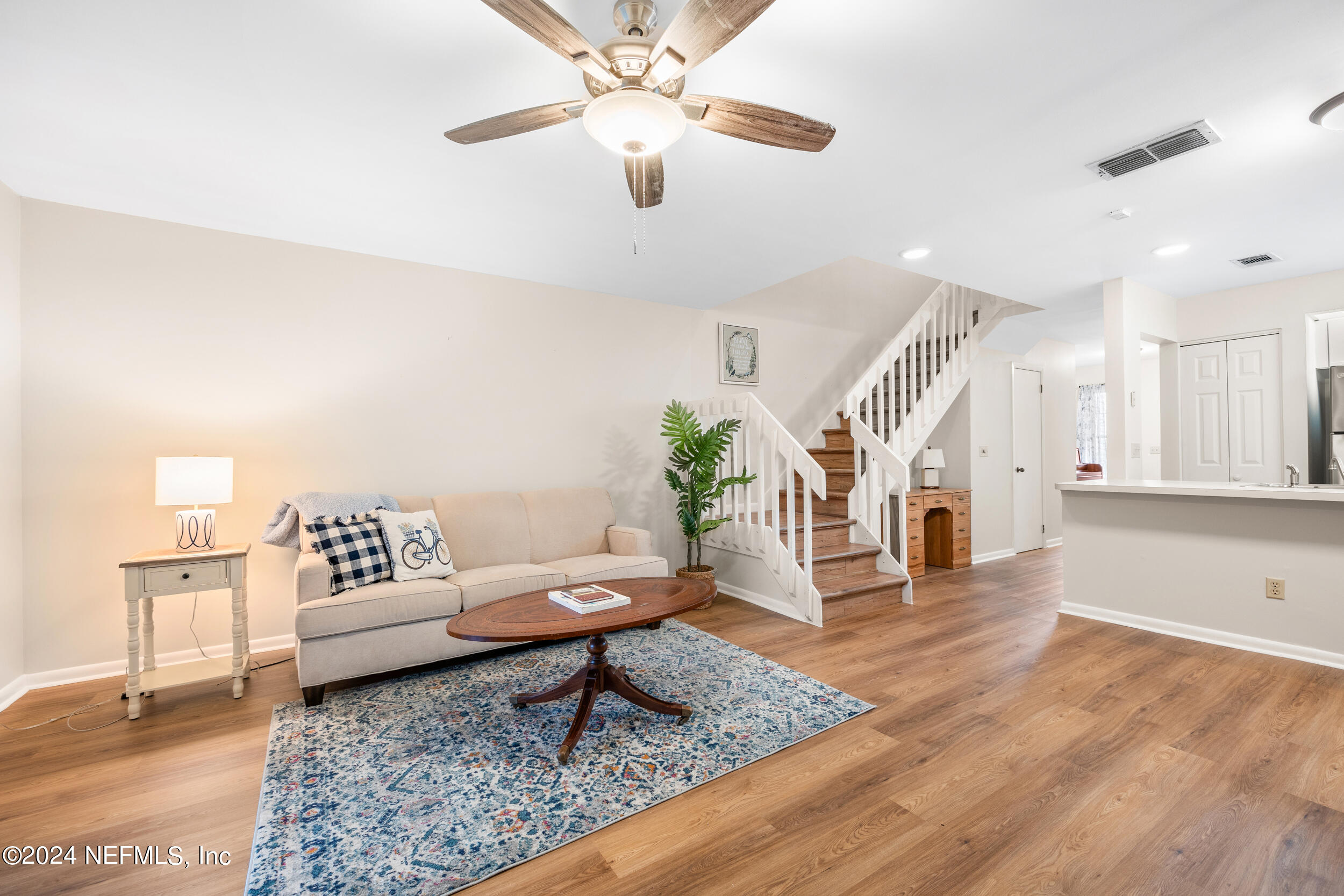 a living room with furniture and a rug