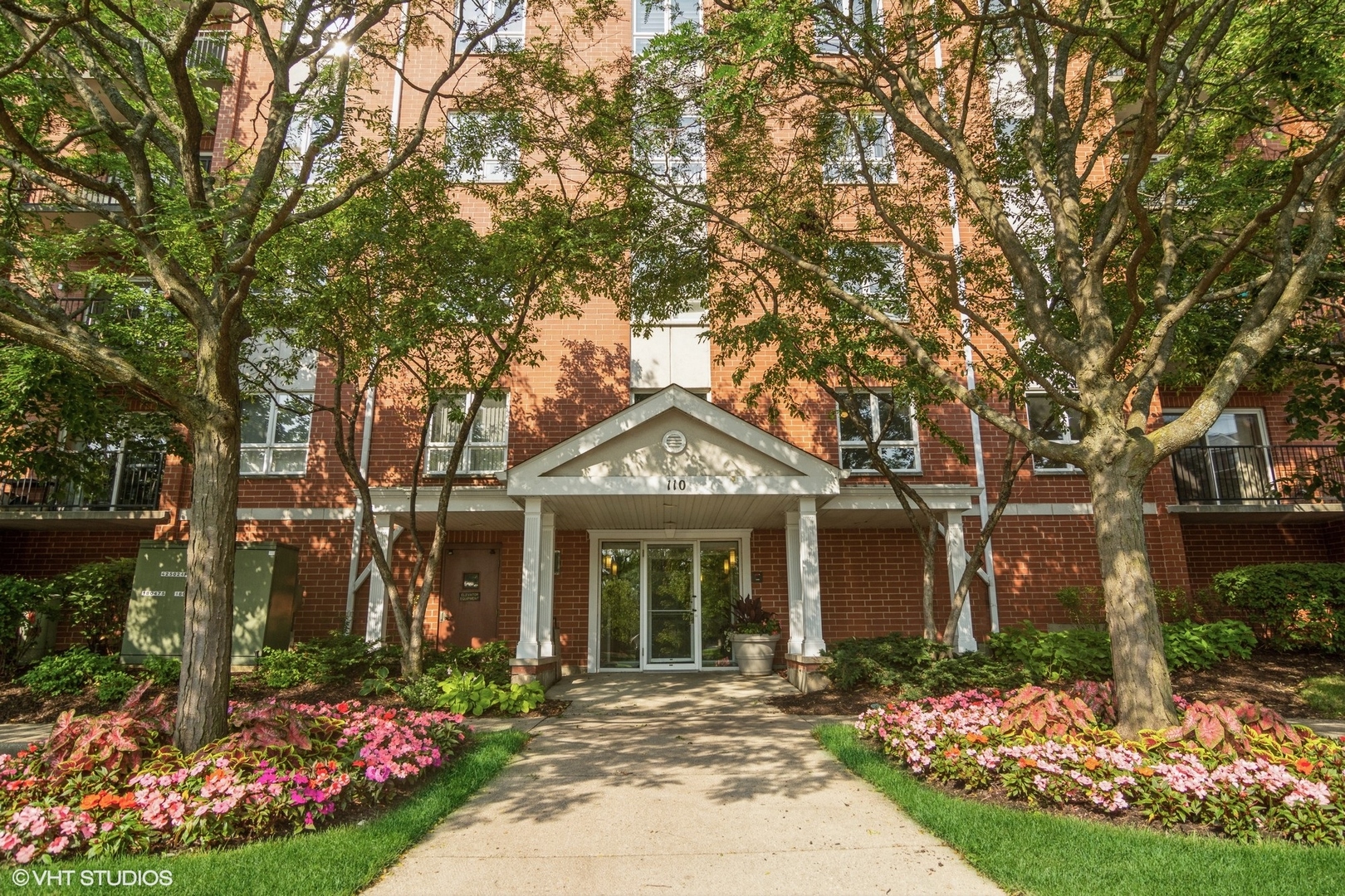 front view of a house with a garden