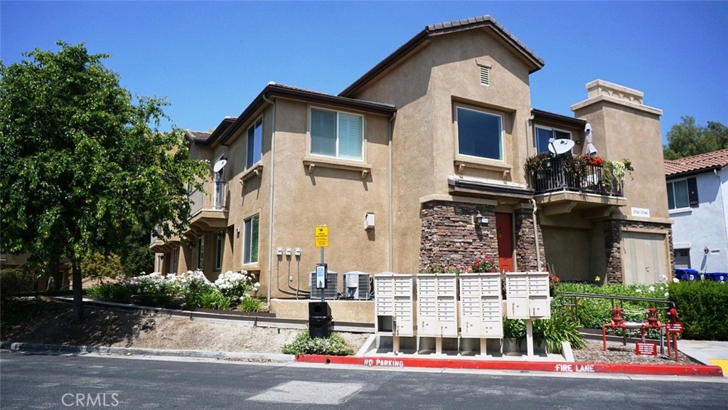 a front view of a residential houses with street