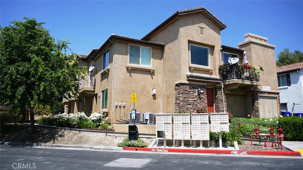 a front view of a residential houses with street