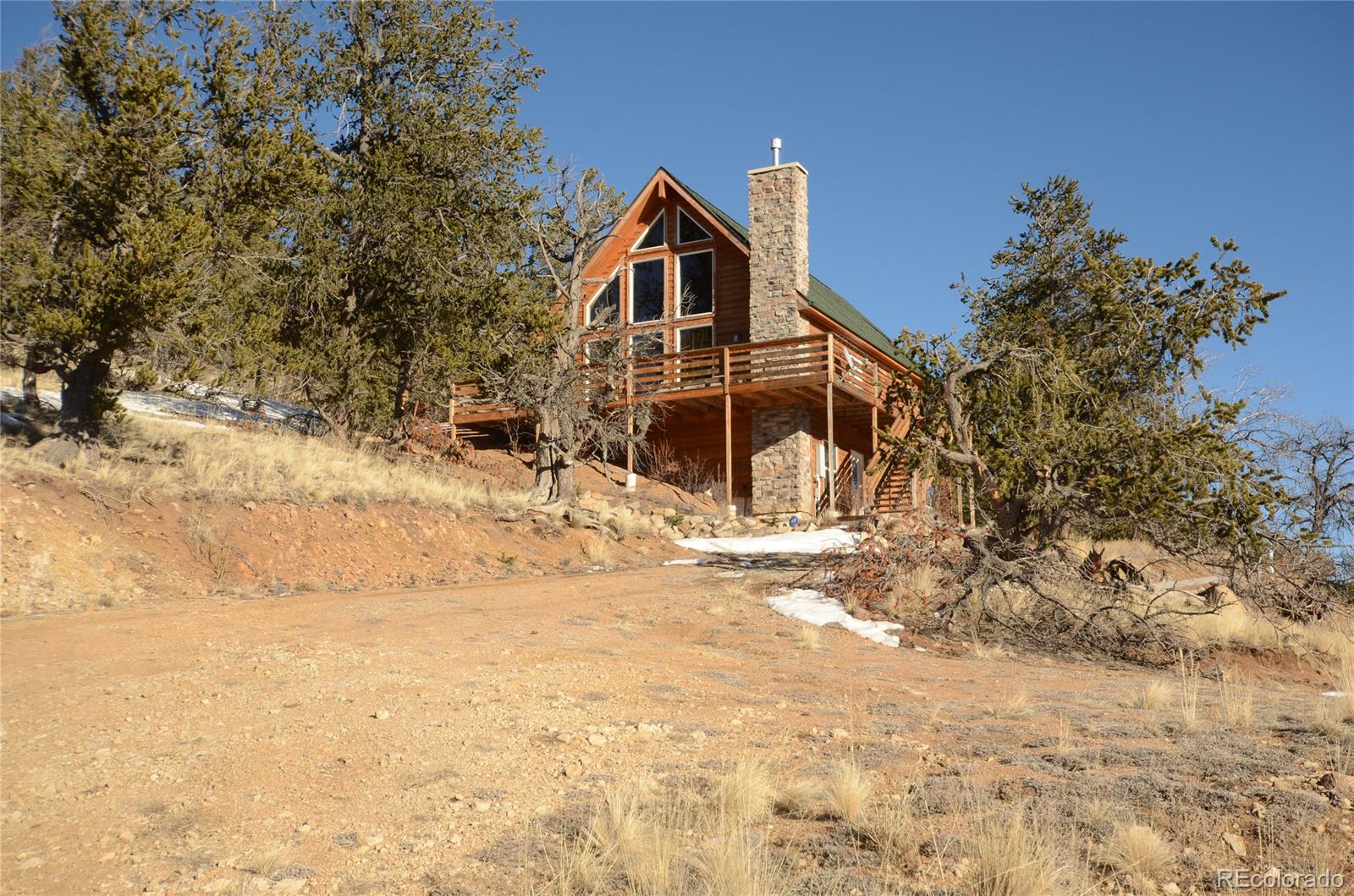 a view of a house with snow on the background