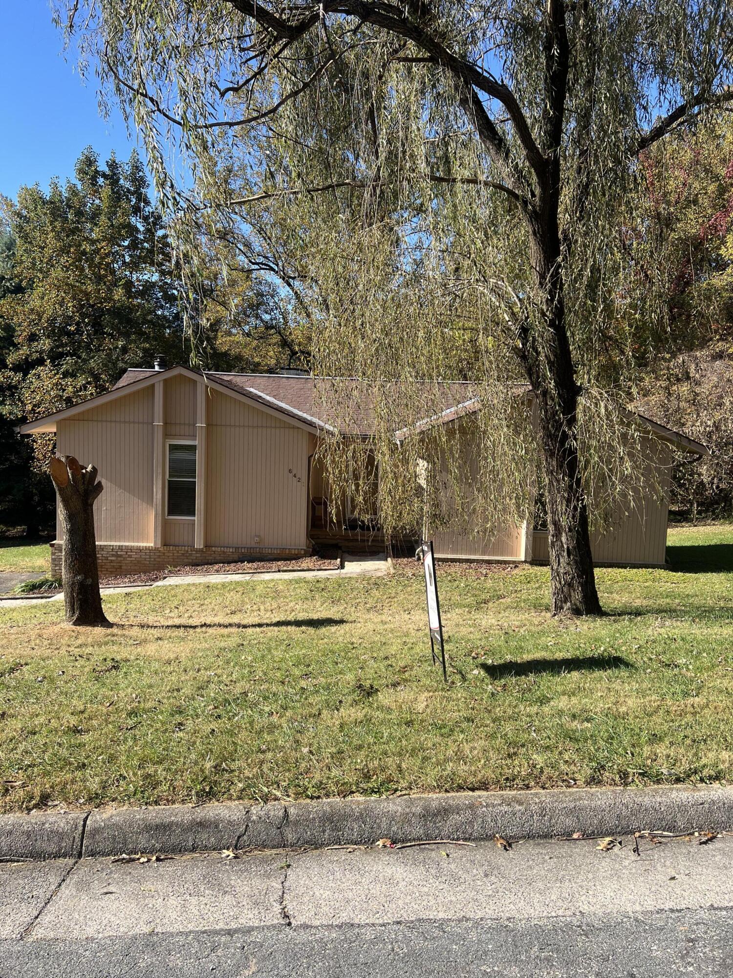 a backyard of a house with trees