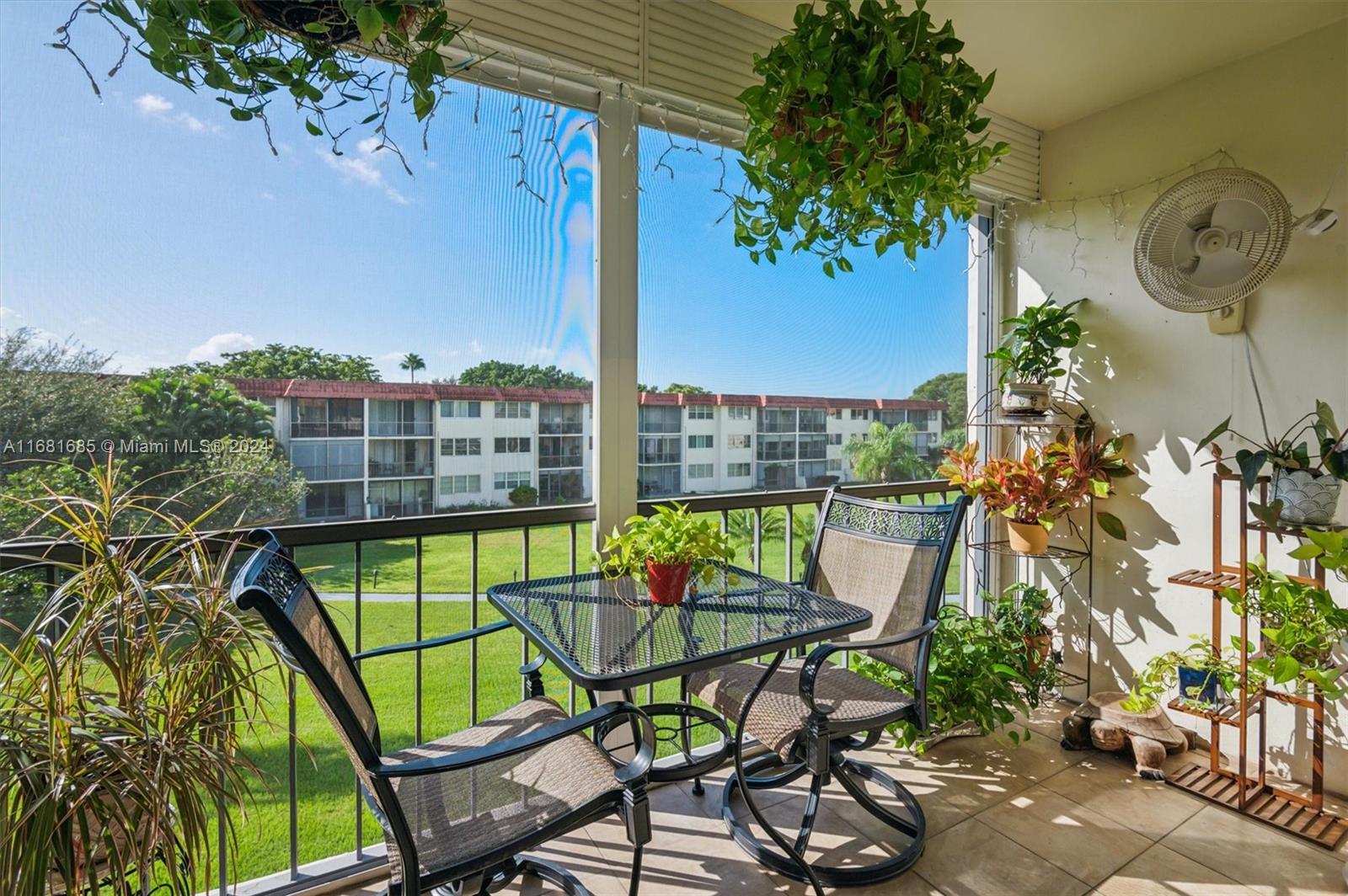 a view of an chairs and table in the patio