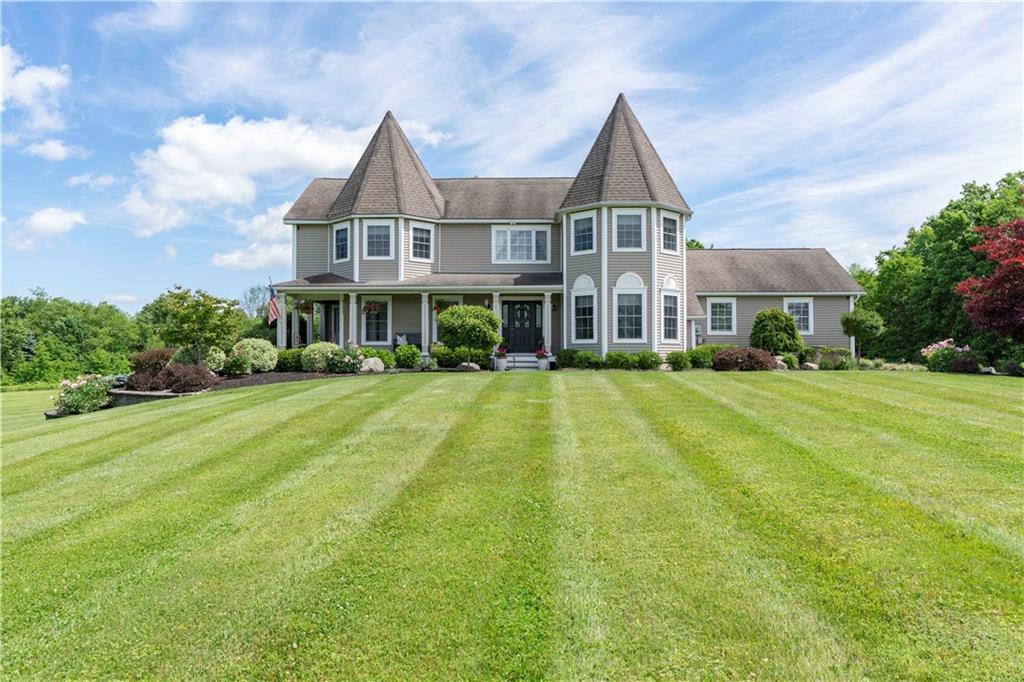 Victorian Colonial style house featuring a front lawn