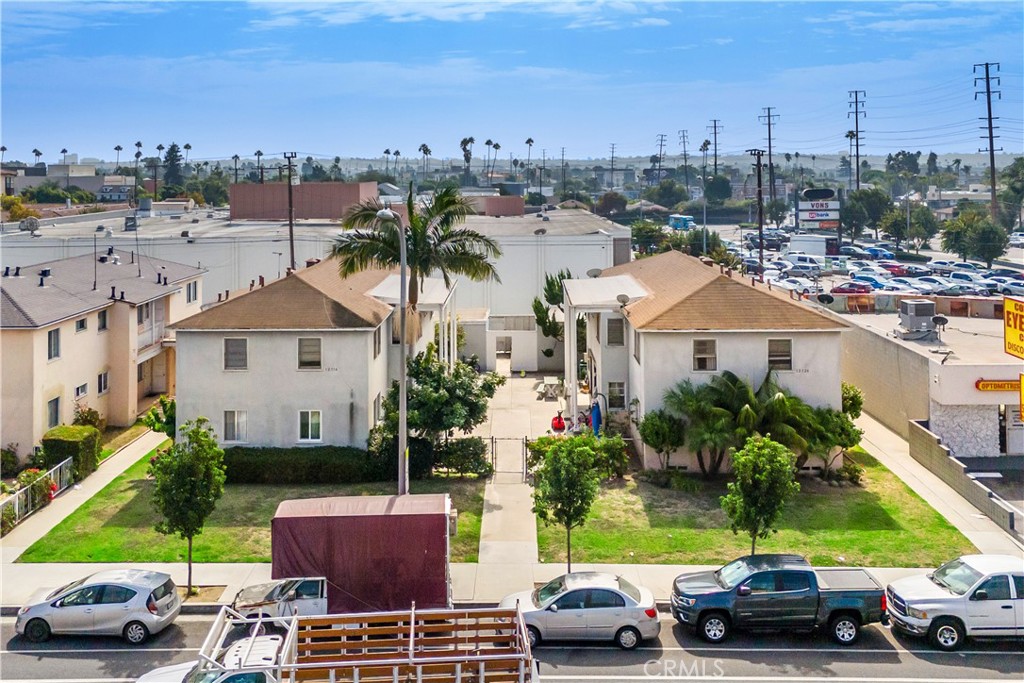 a view of multiple houses with a yard