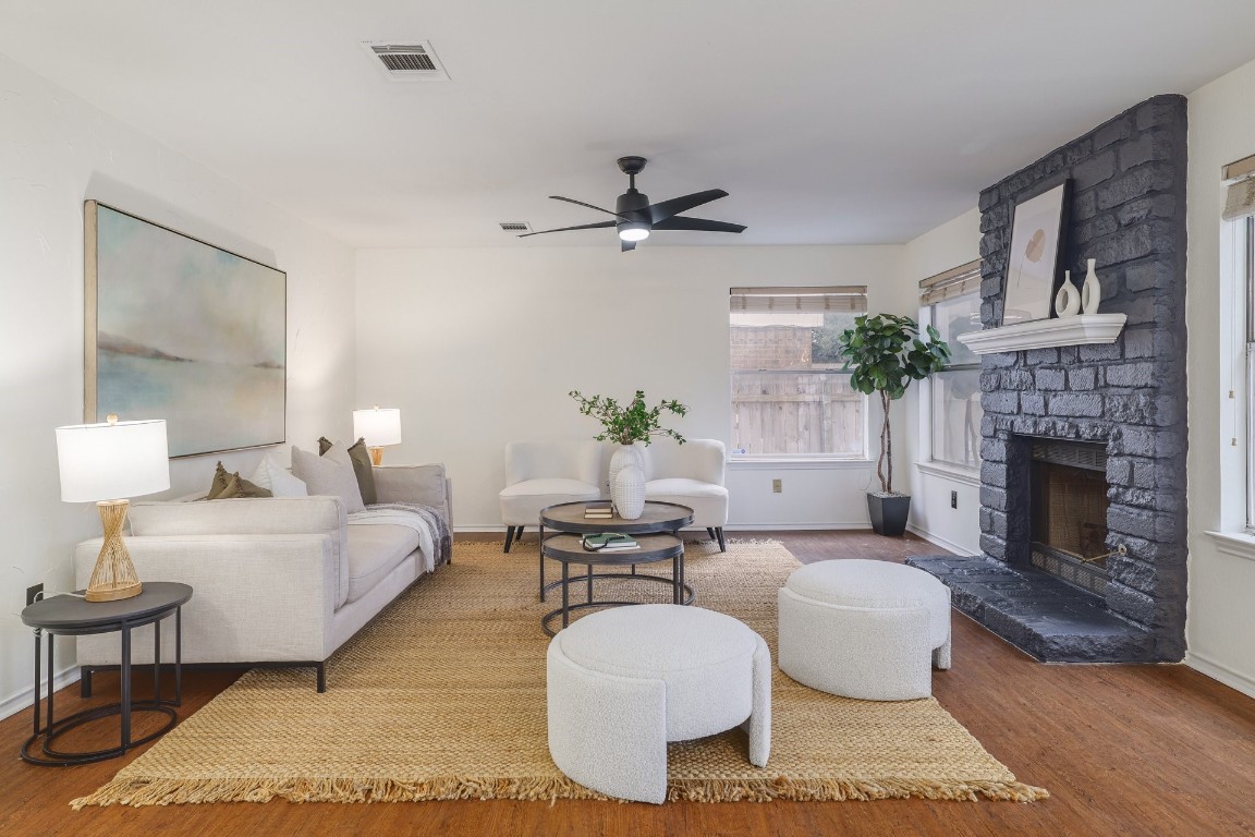 Natural light floods the family room through large windows overlooking the backyard.