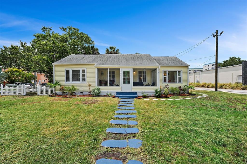 a front view of a house with a yard