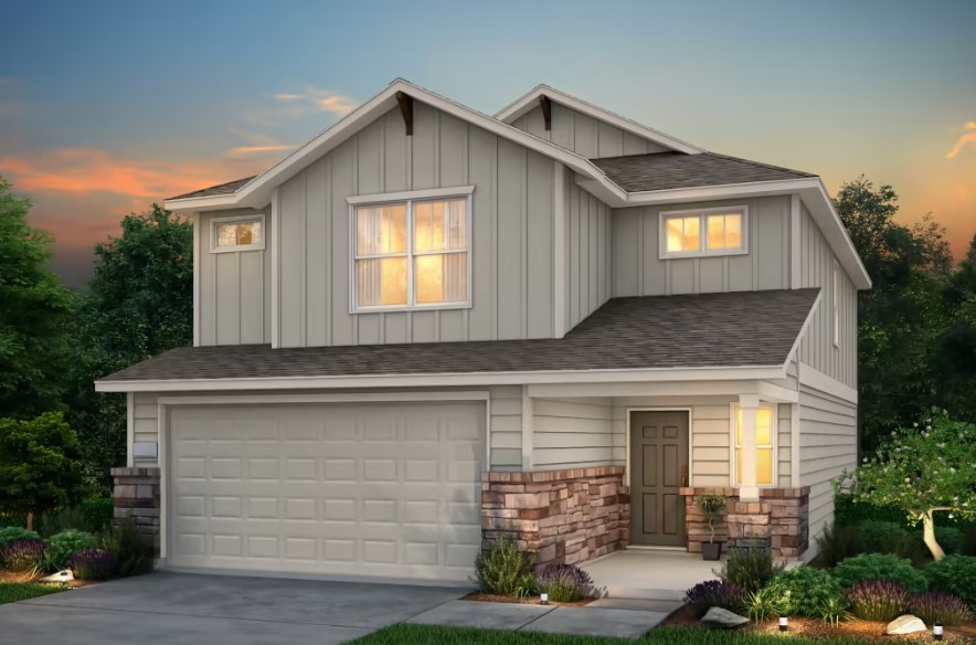 a front view of a house with garage