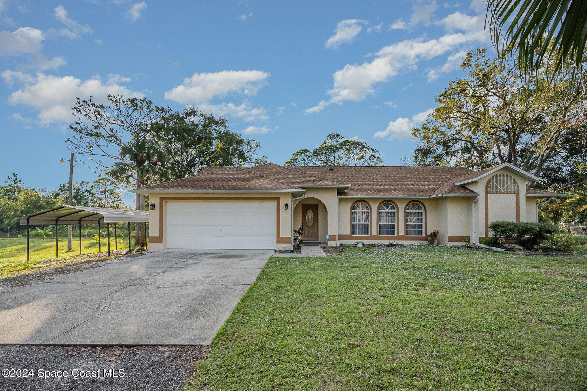 front view of a house with a yard