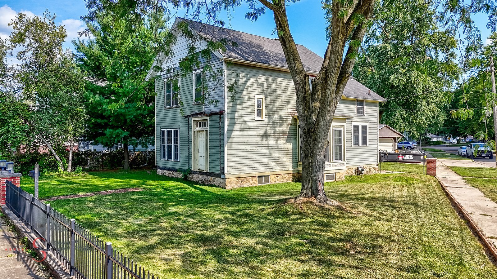 a view of a house with pool and tree s