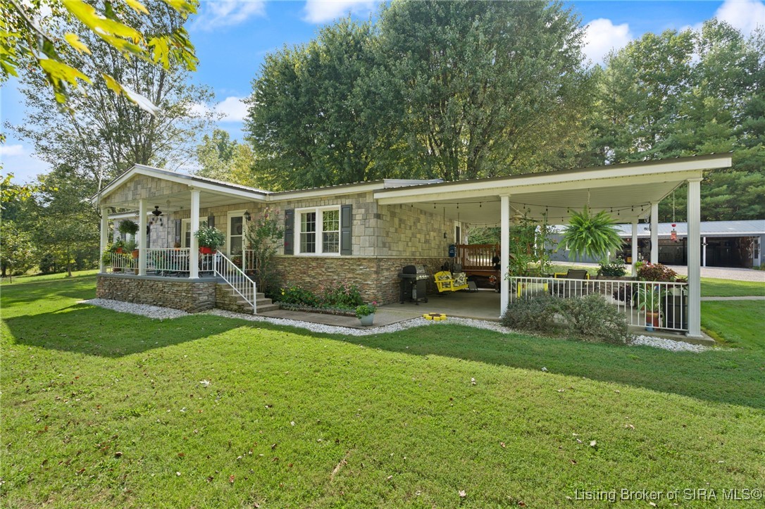 covered front porch with a side covered patio.