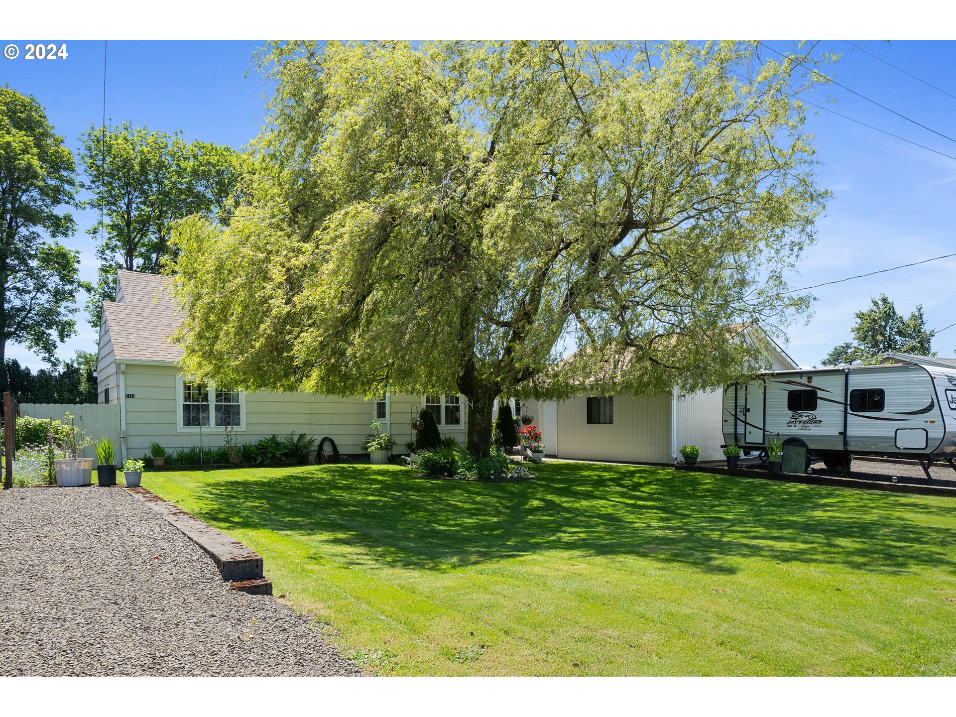 a view of a house with a big yard