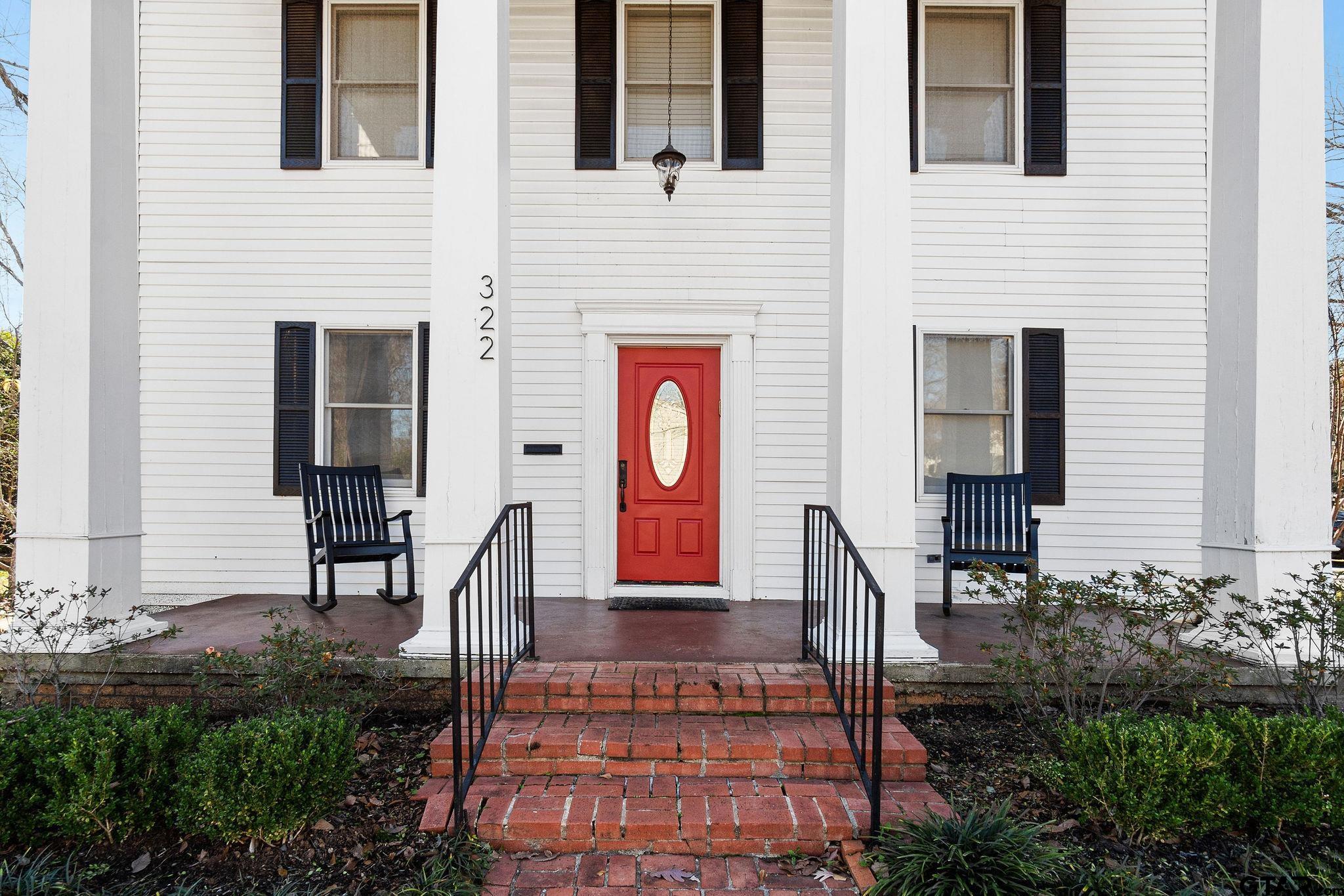 a view of front door and outdoor seating