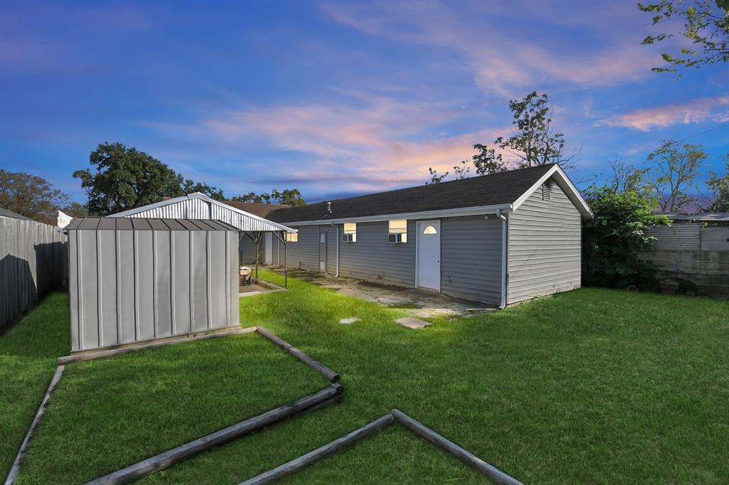 a view of a backyard with a garden and plants