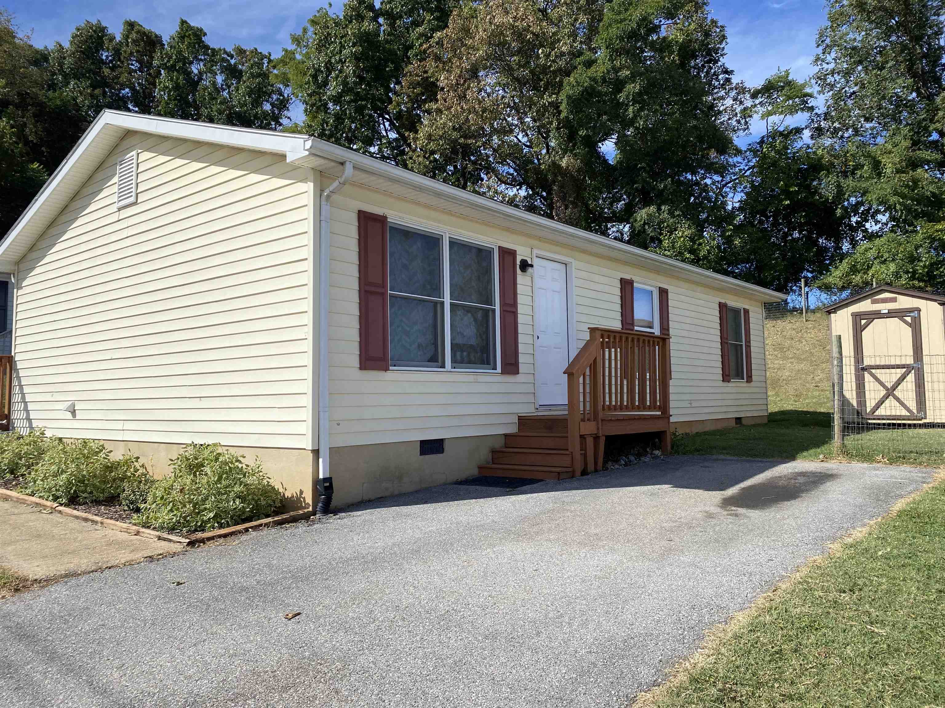 a view of a house with a backyard and a garage