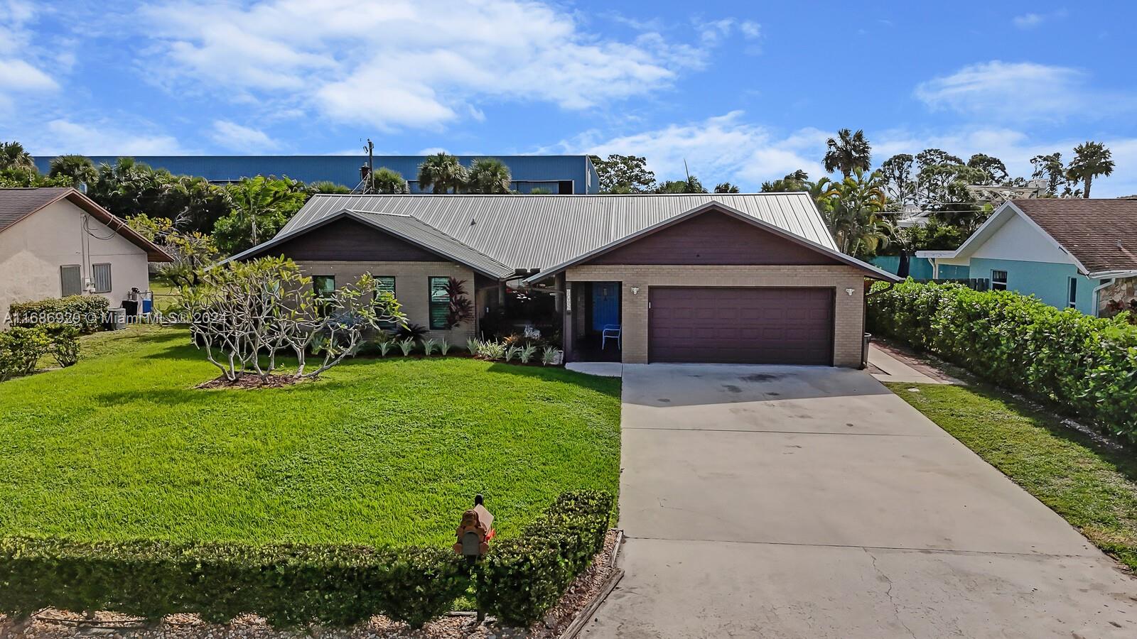 a front view of a house with garden