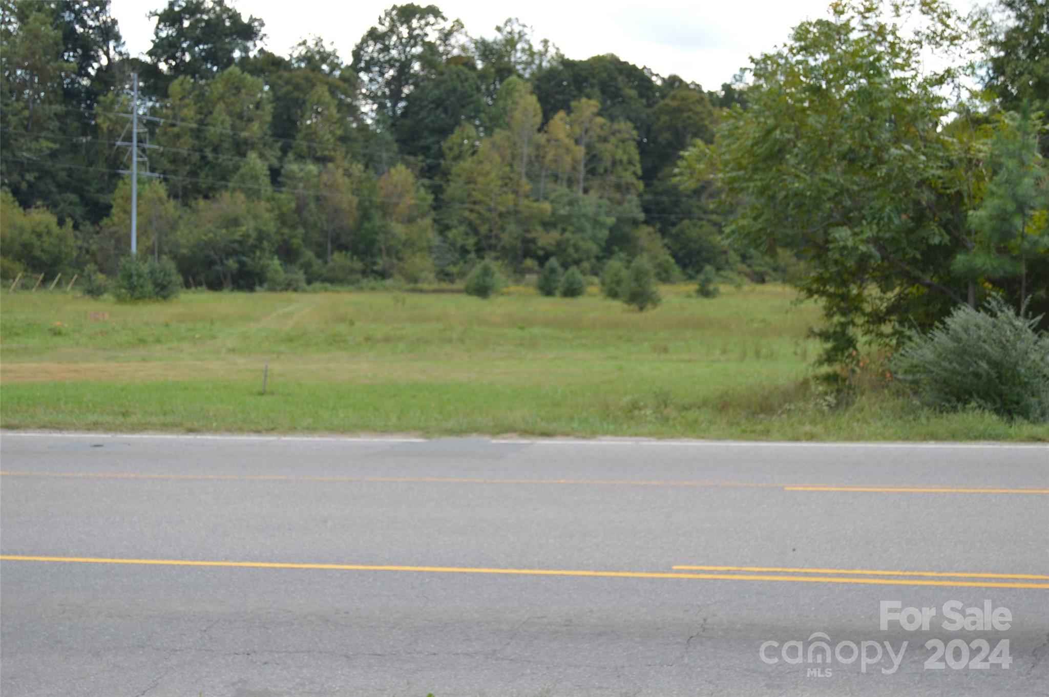 a view of a road with a yard