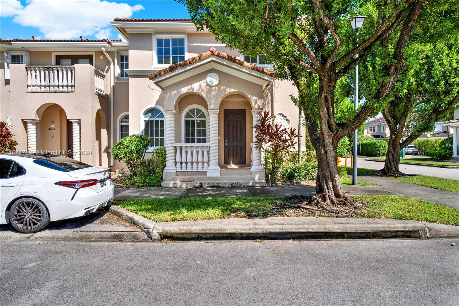 a front view of a house with garden