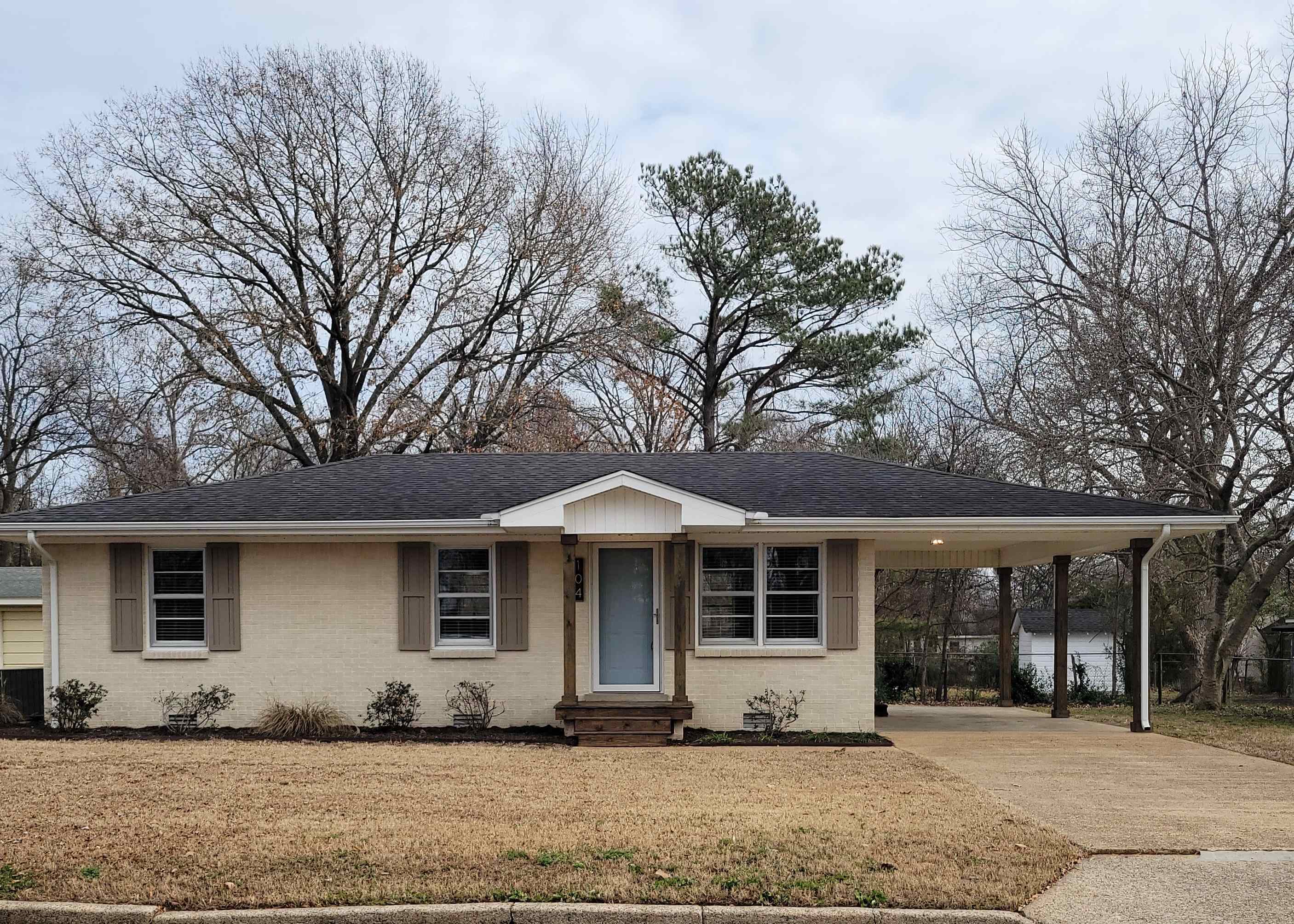 a front view of a house with a yard