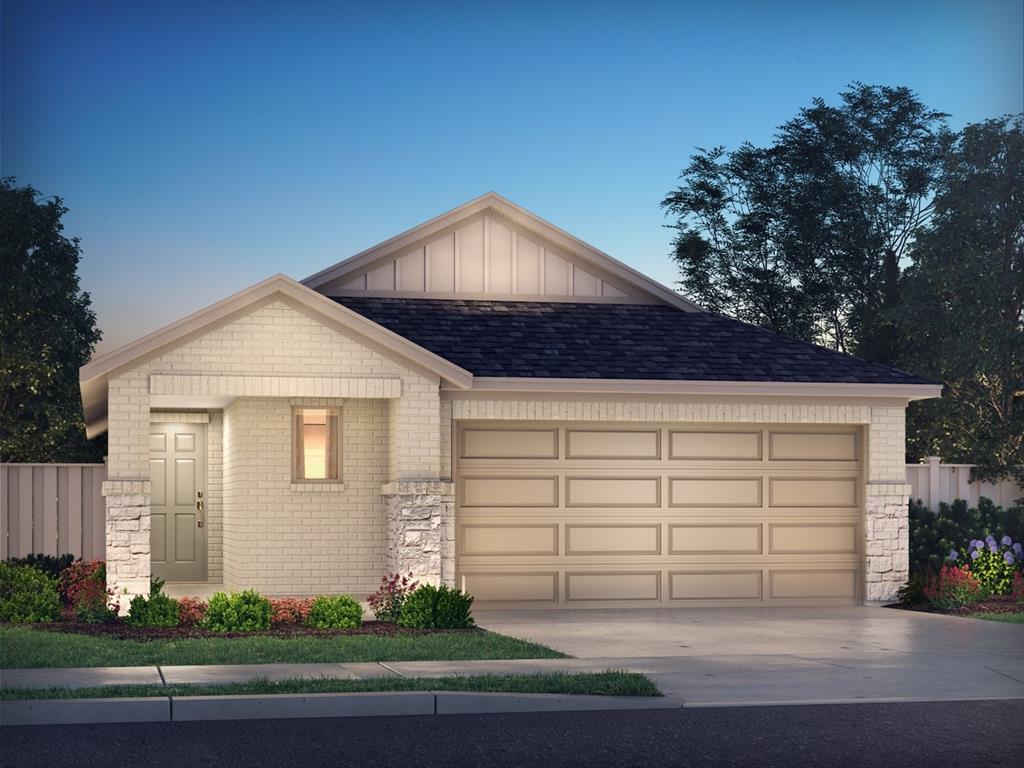 a front view of a house with garage