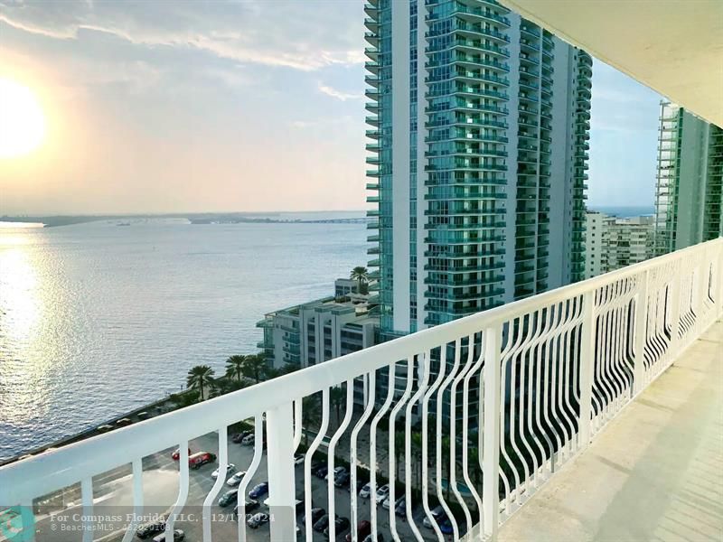 a balcony with an ocean view