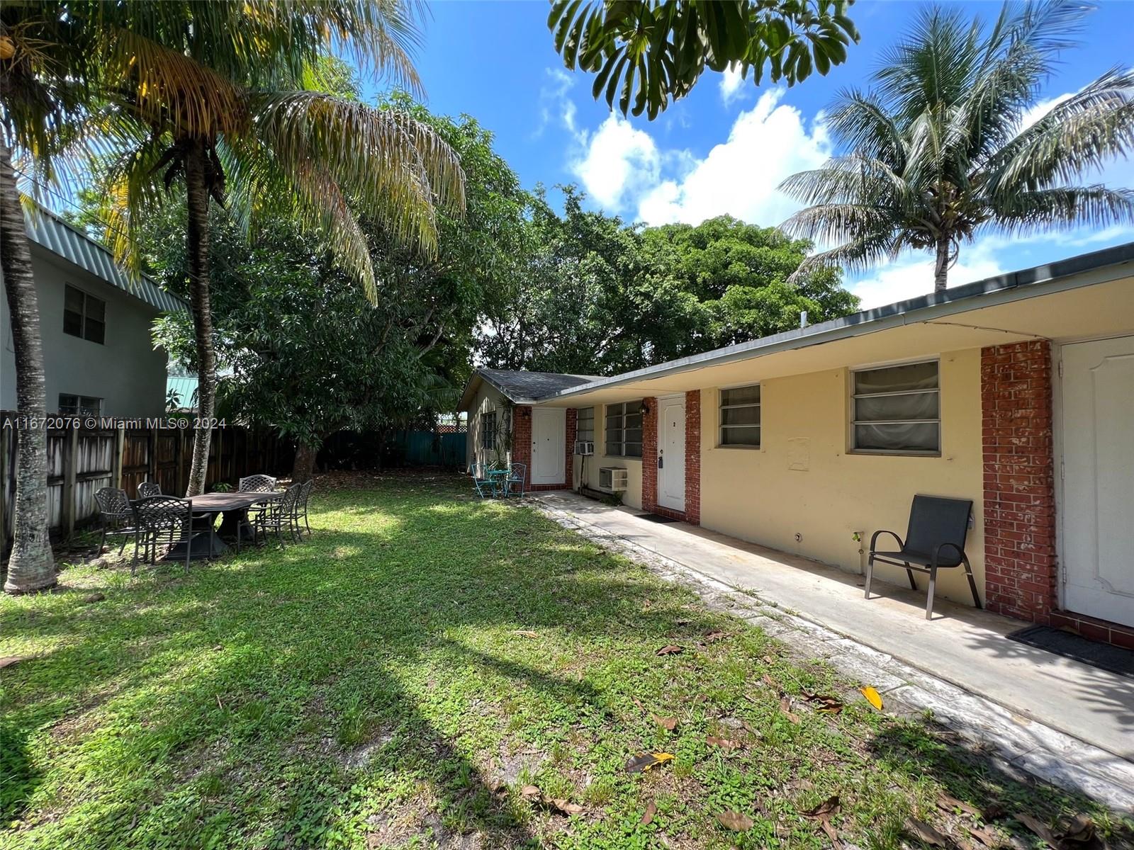 a view of a backyard with a patio