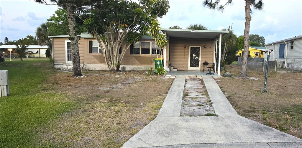 front view of a house with a yard