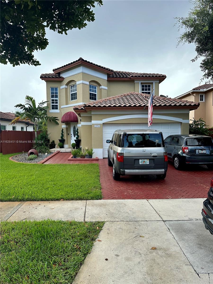 a car parked in front of a house