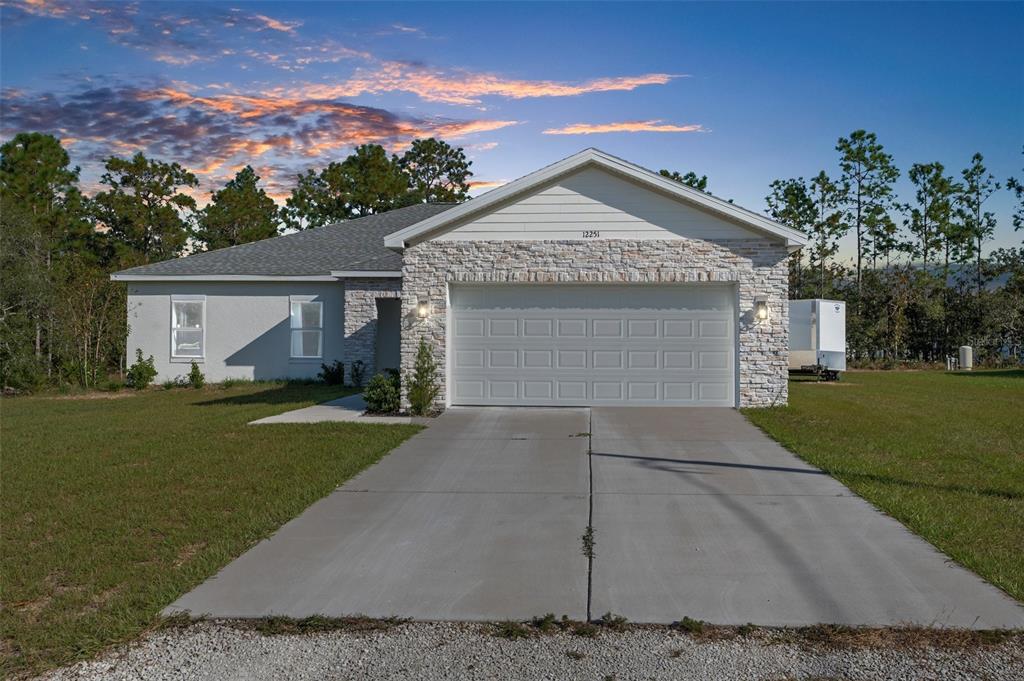 front view of a house with a yard