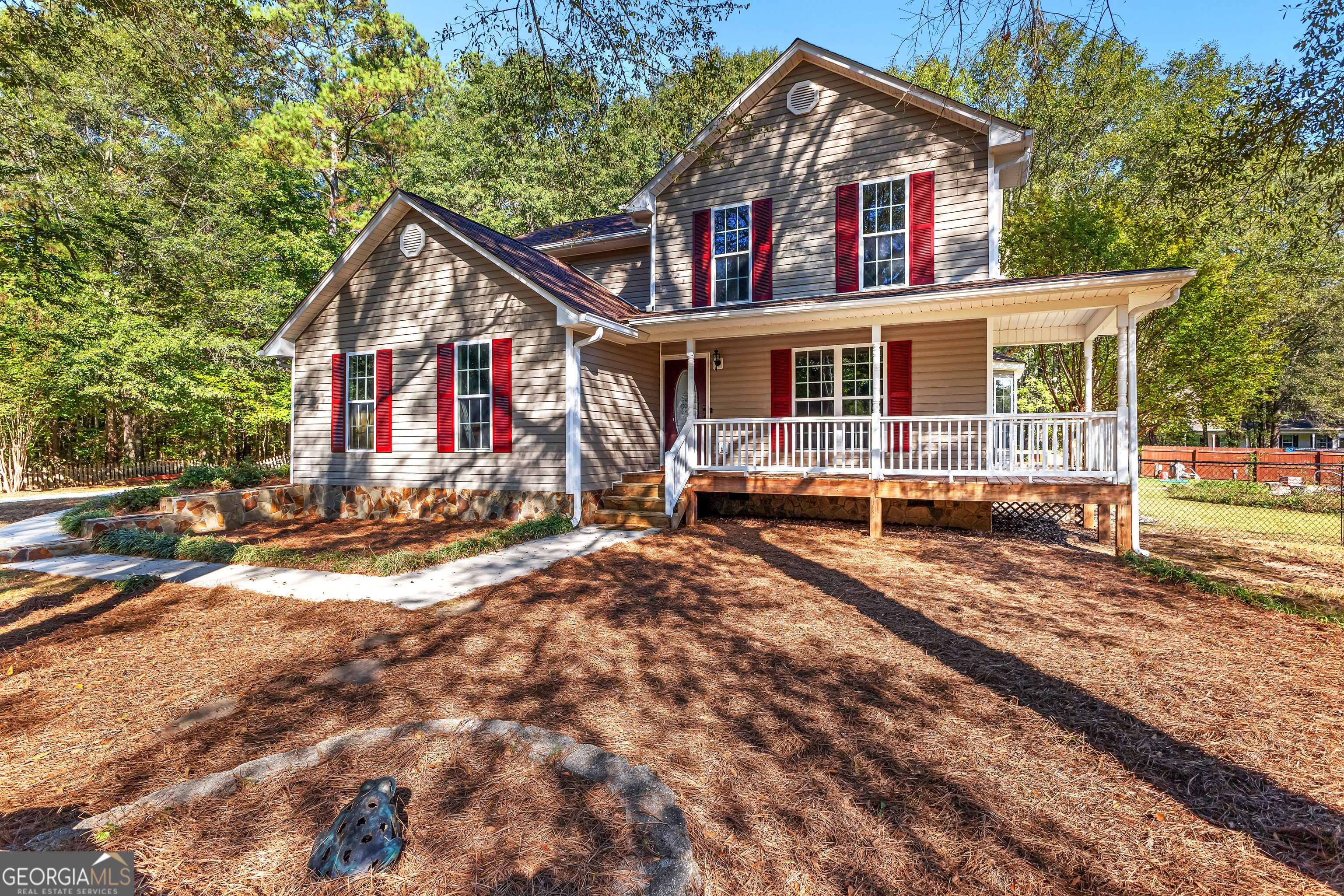 a view of house with a yard