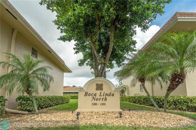 a view of a tree in front of a house