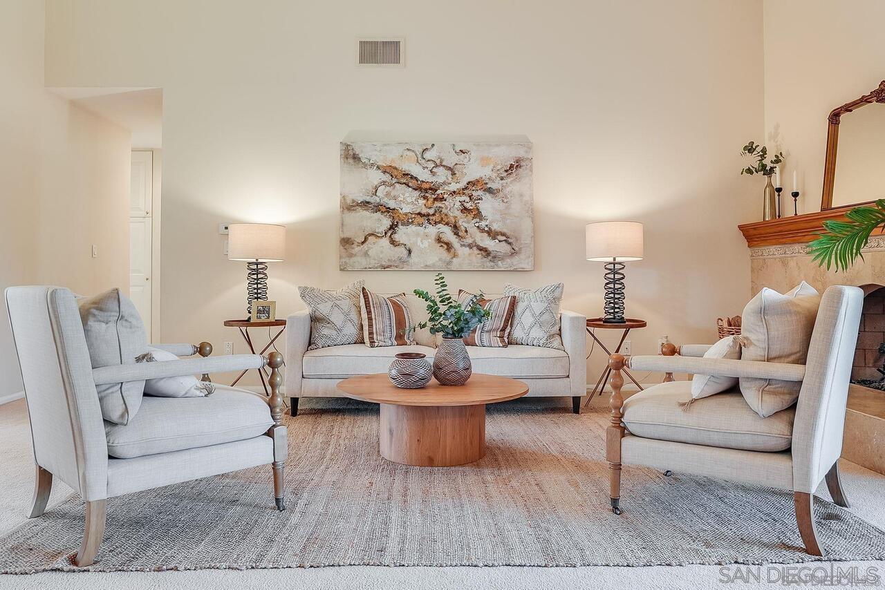 a living room with furniture and white walls