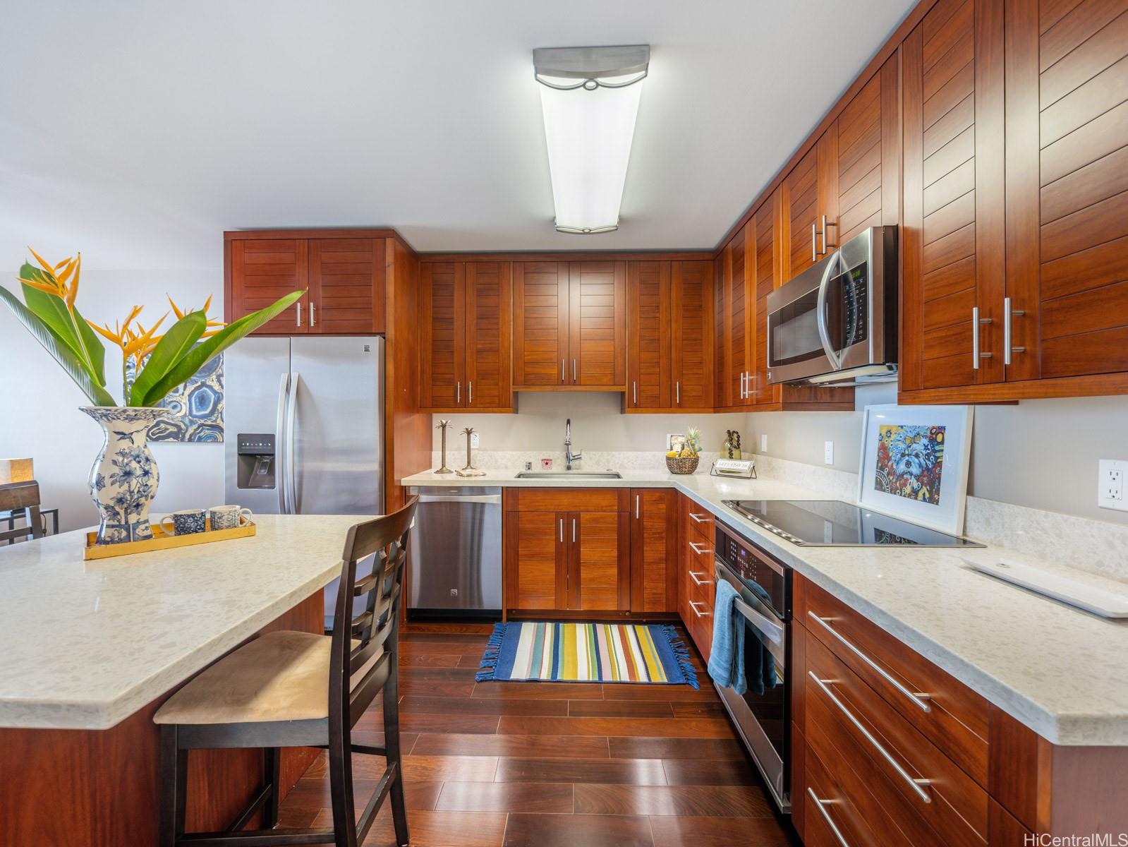 a kitchen with a table chairs sink and cabinets