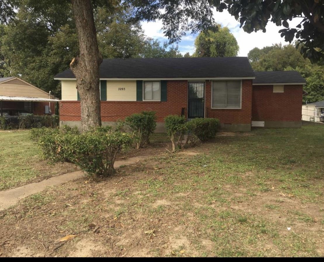 front view of a house with a yard