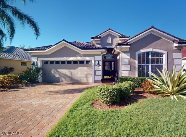 a front view of a house with a yard