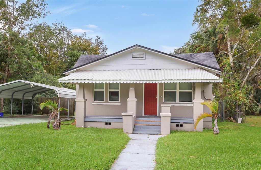 a front view of house with yard and green space