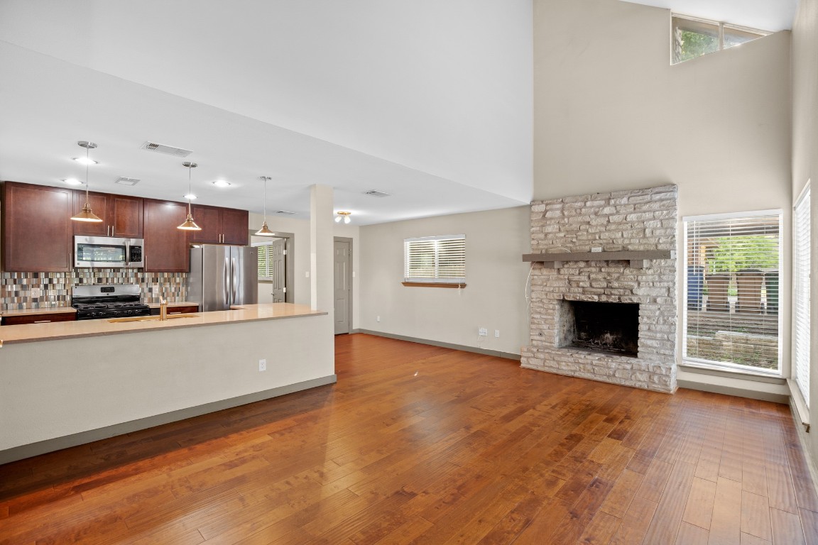 a view of kitchen with furniture and fireplace