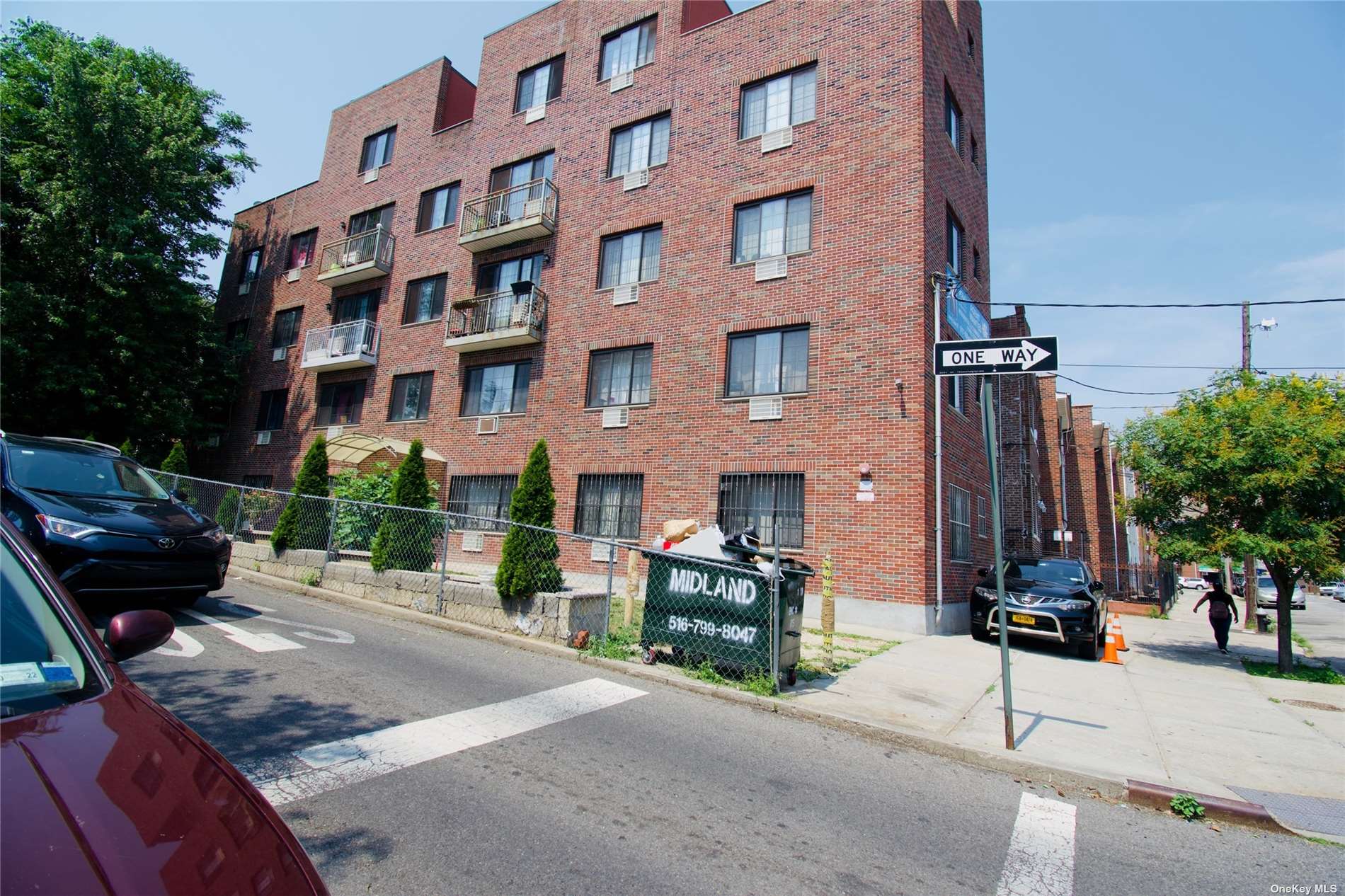 a view of a brick building with many windows