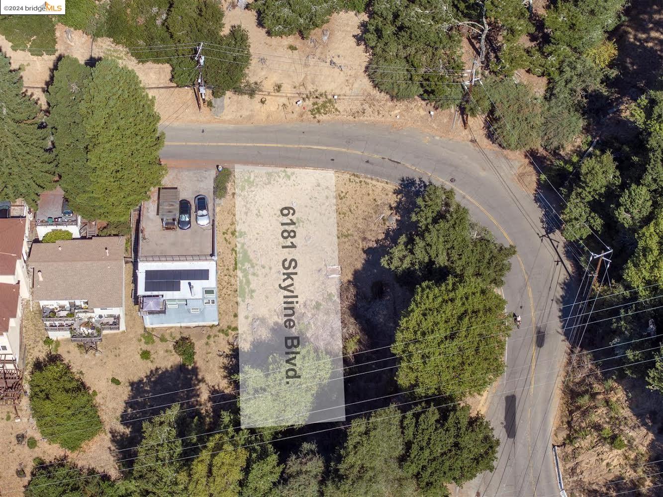 an aerial view of a house with outdoor space