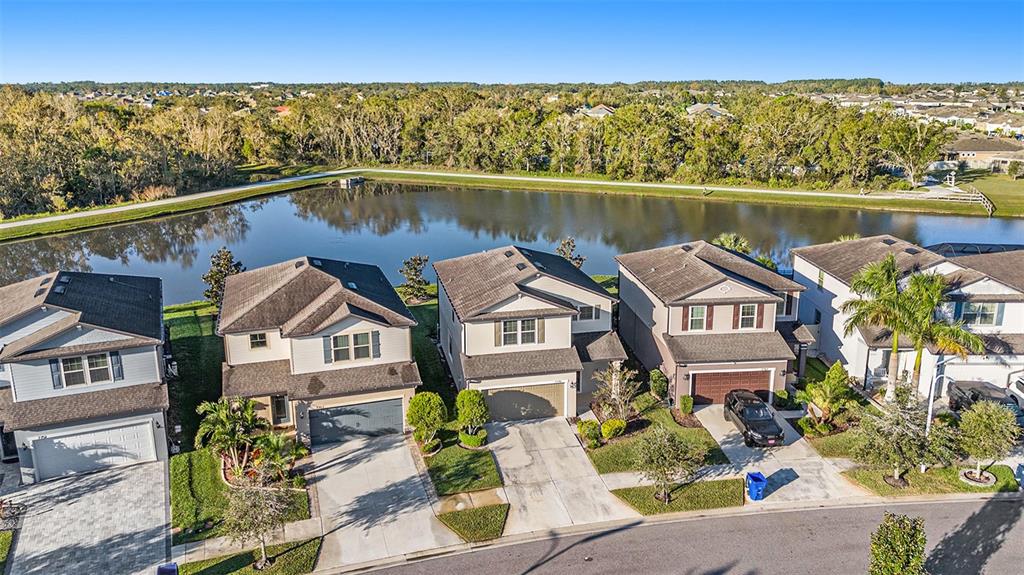 an aerial view of a house with a lake view