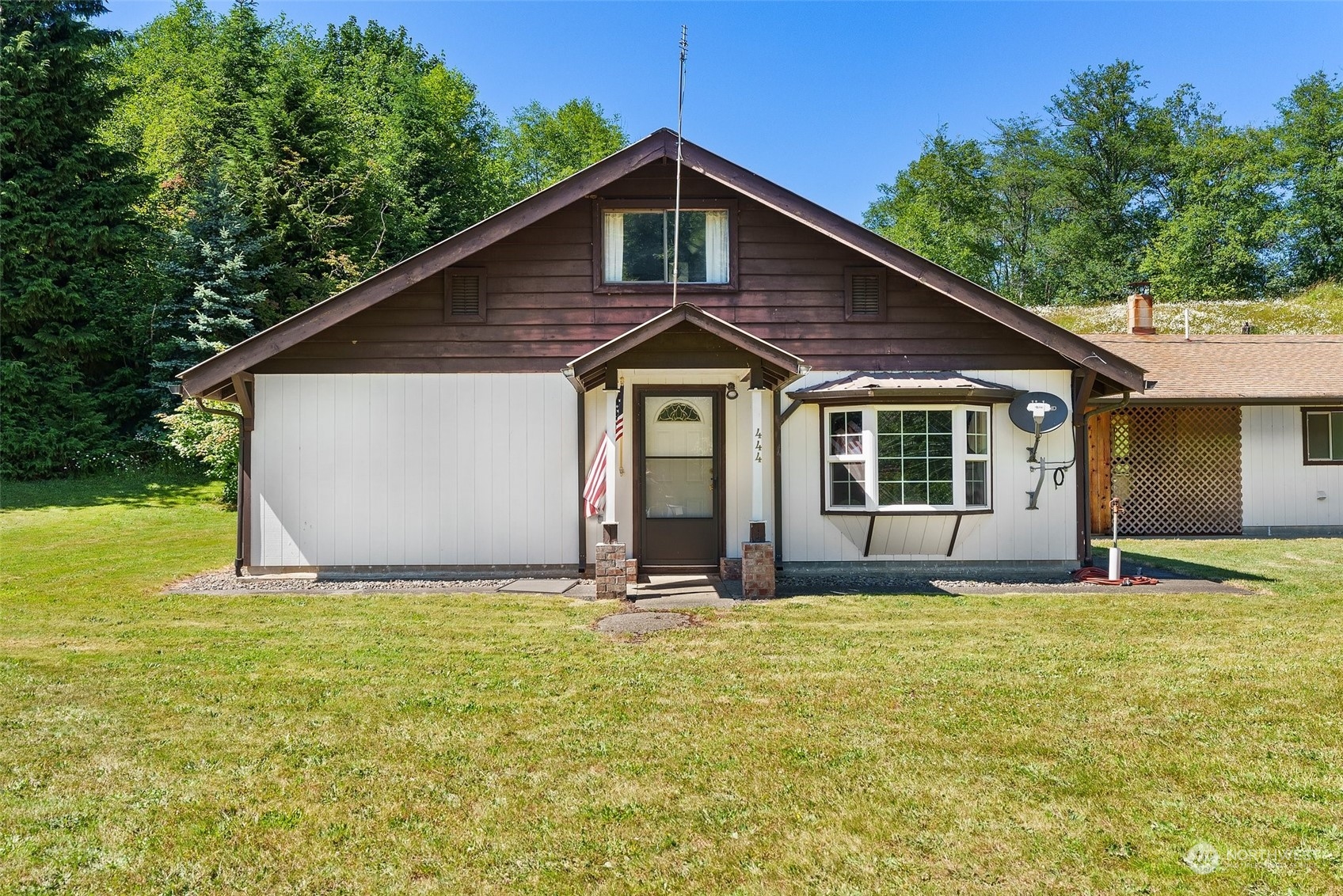 a front view of a house with yard