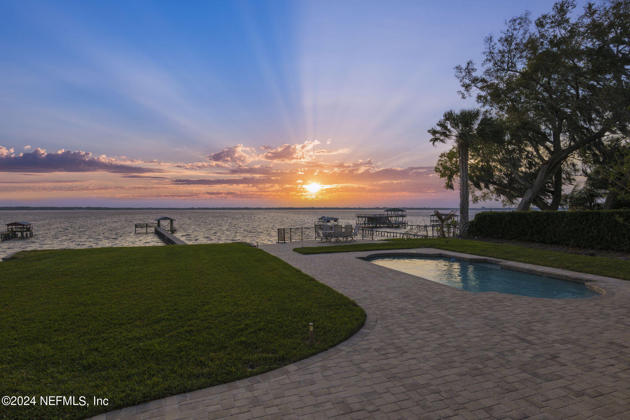 a view of a swimming pool and an outdoor seating