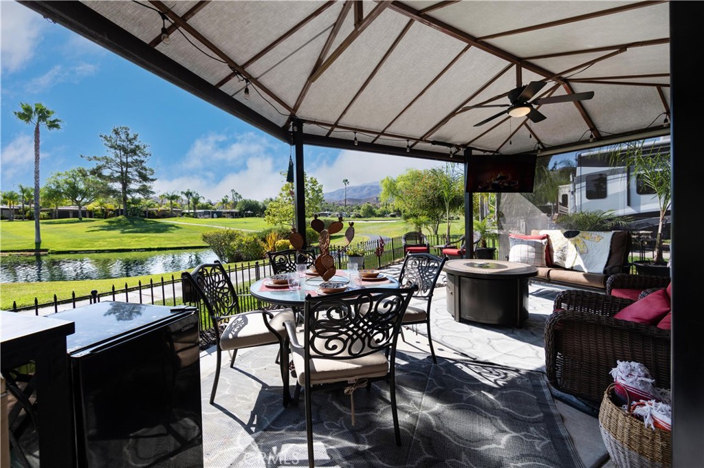 a view of a patio with a table chairs and a table