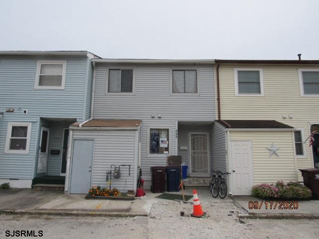 a front view of a house with garage