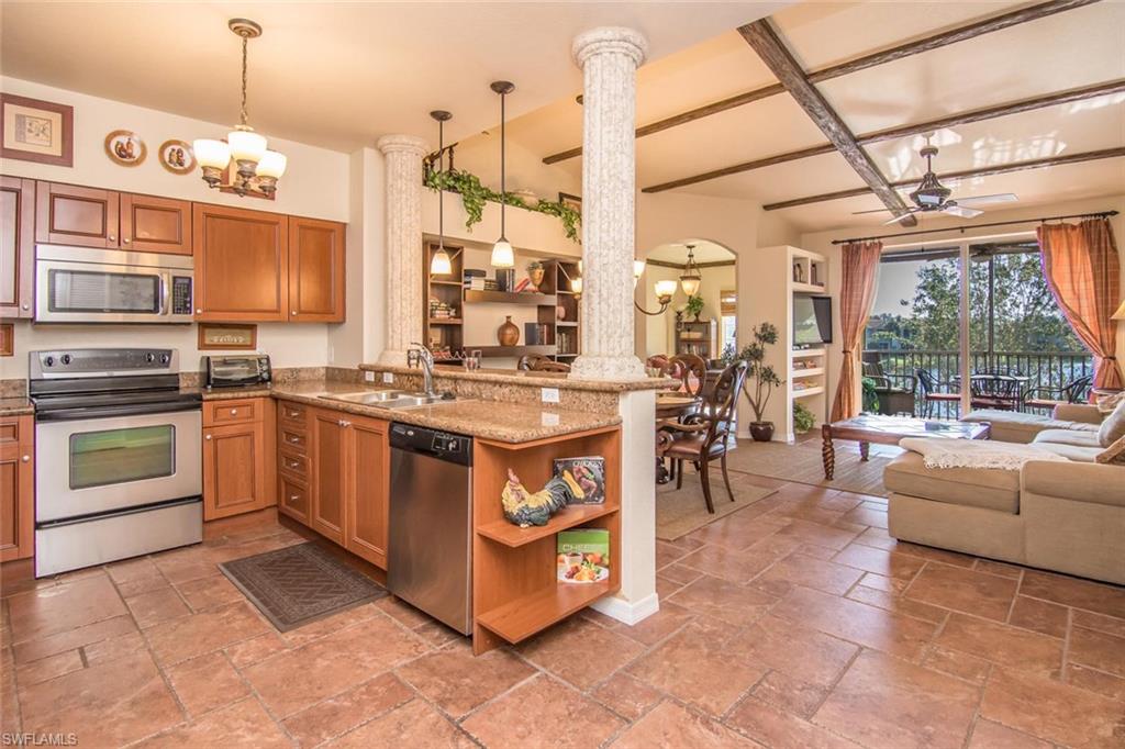 a kitchen with stainless steel appliances granite countertop a stove and a sink