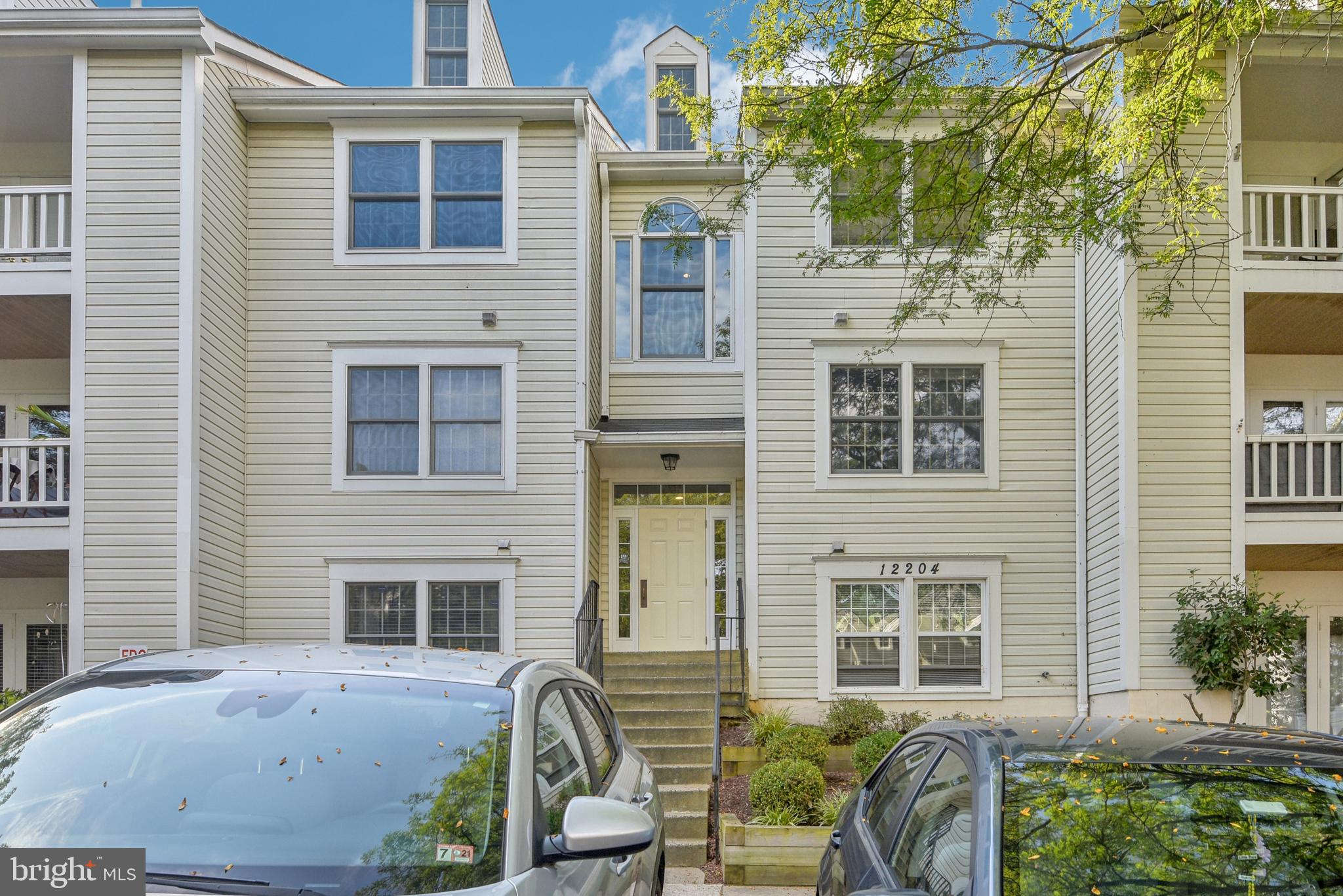 a front view of a house with outdoor seating